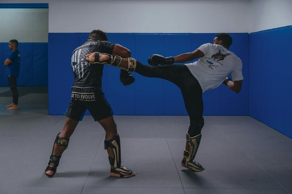 How can triathletes balance their training across swimming, cycling, and running disciplines?